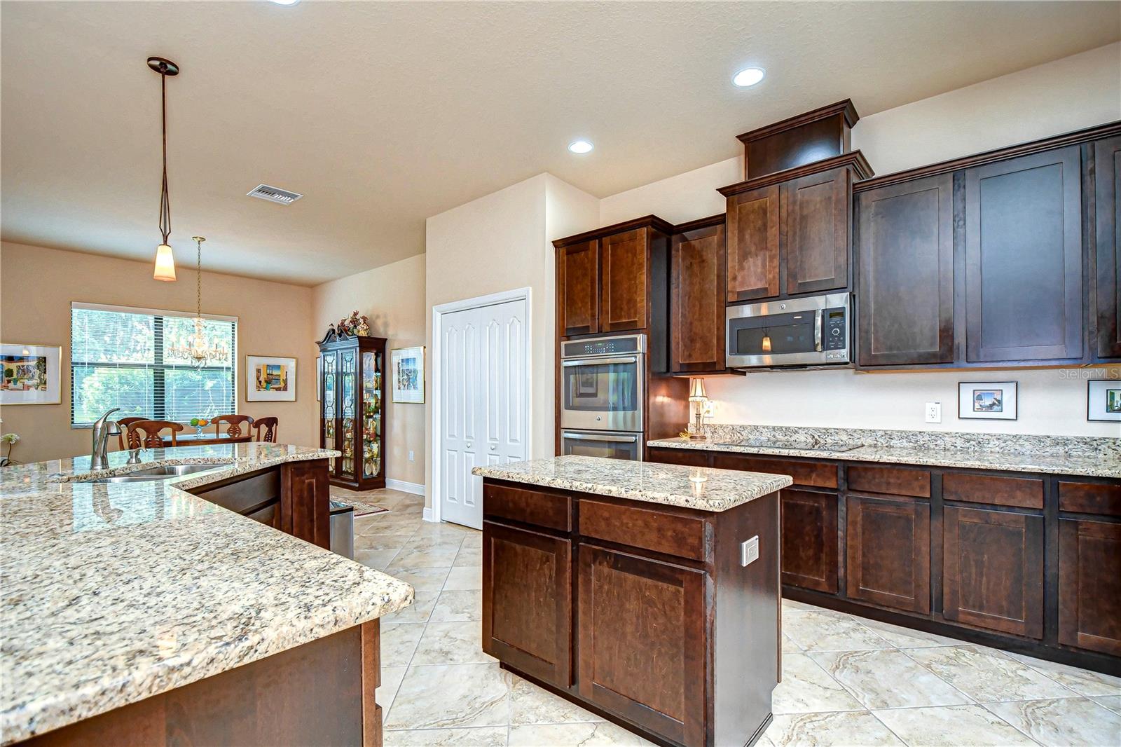 Stainless appliances and rich wood cabinetry!