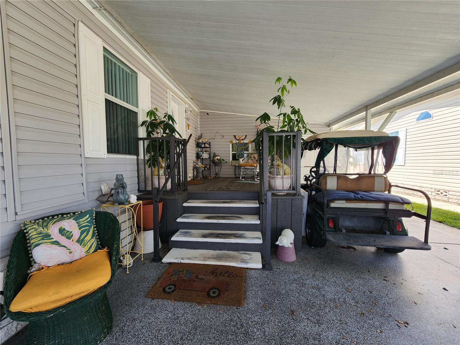 Carport entry with composite decking.