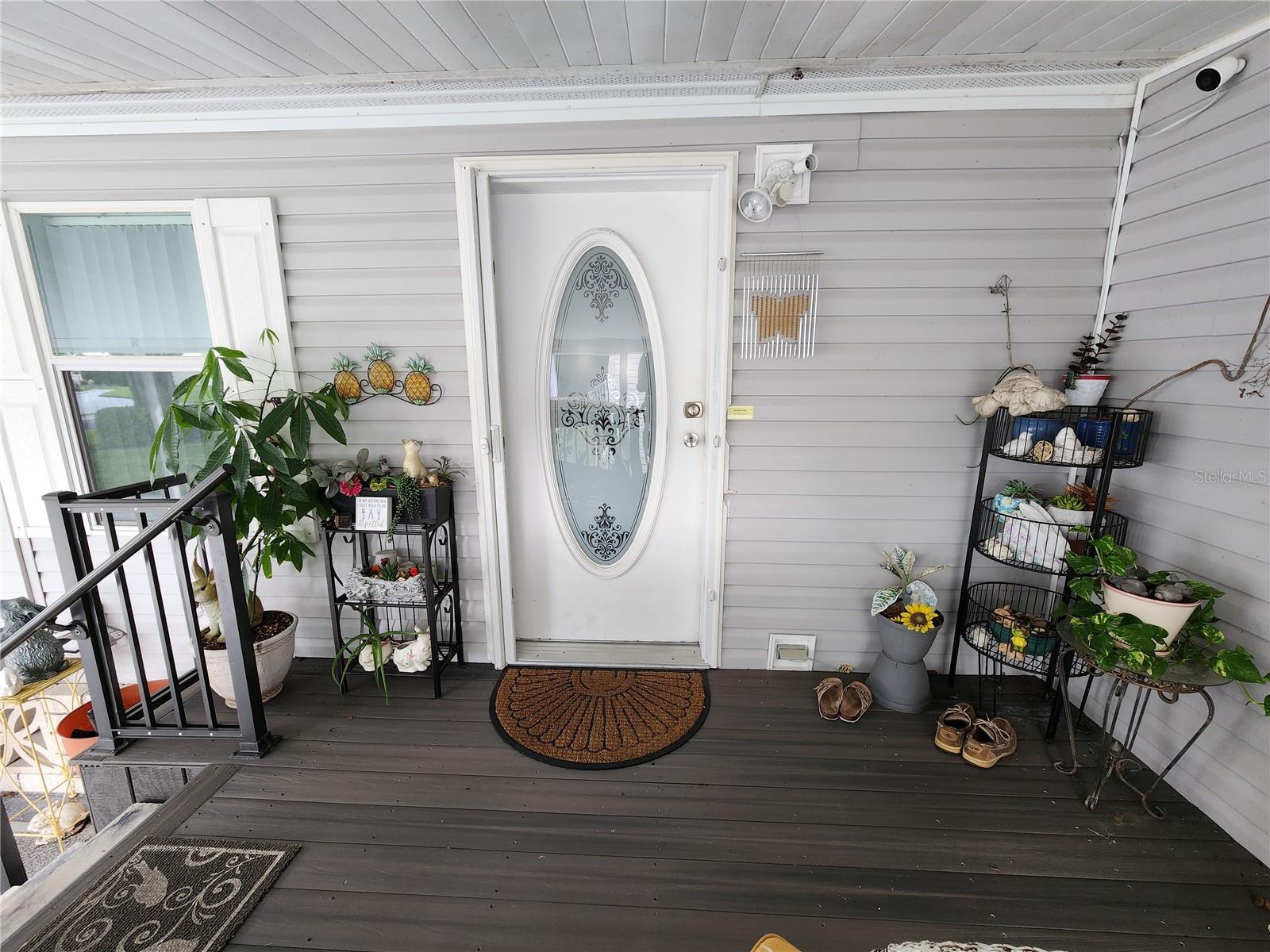 Carport entry with composite decking.