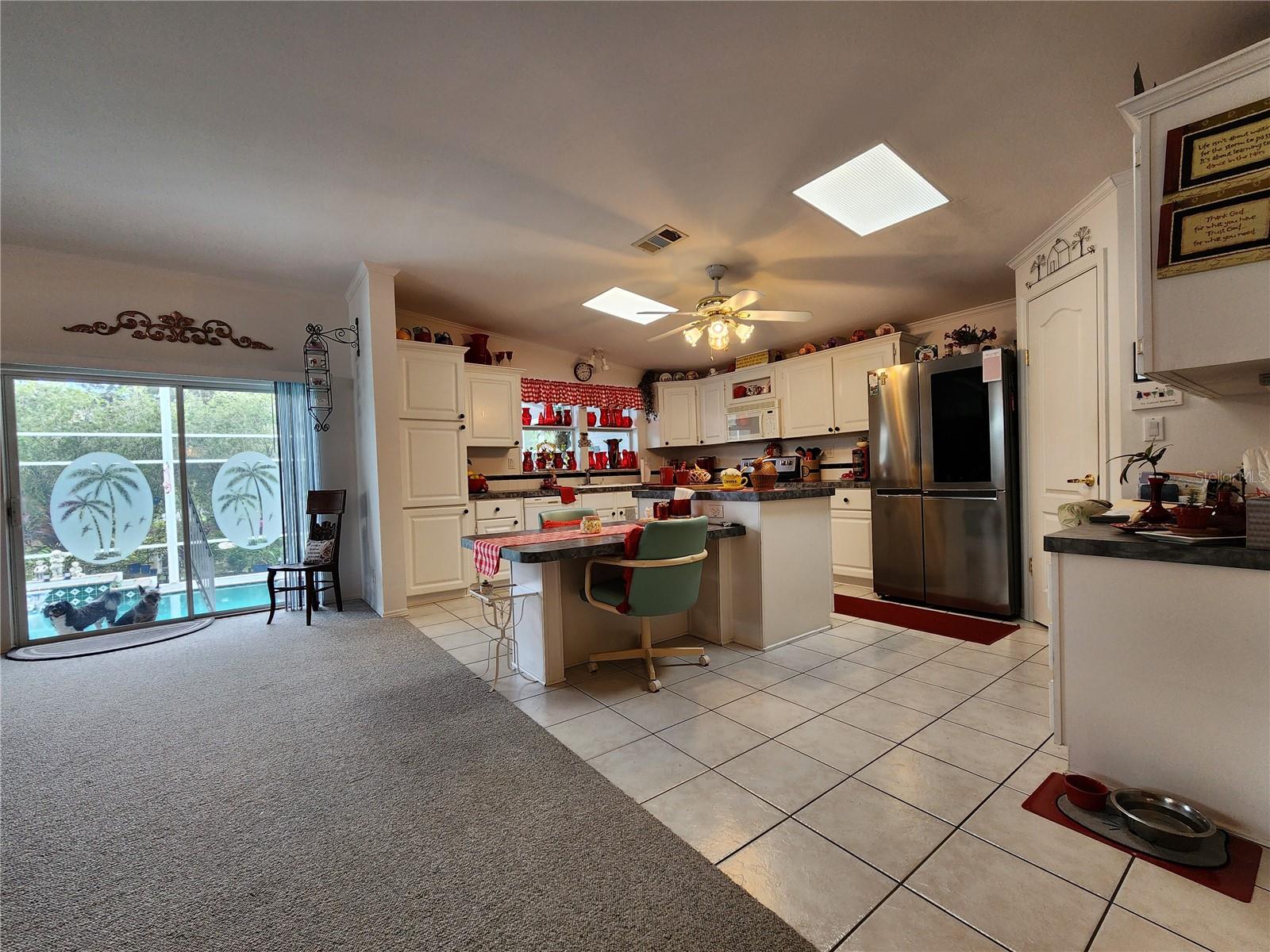 Kitchen and sliding glass door to pool area.