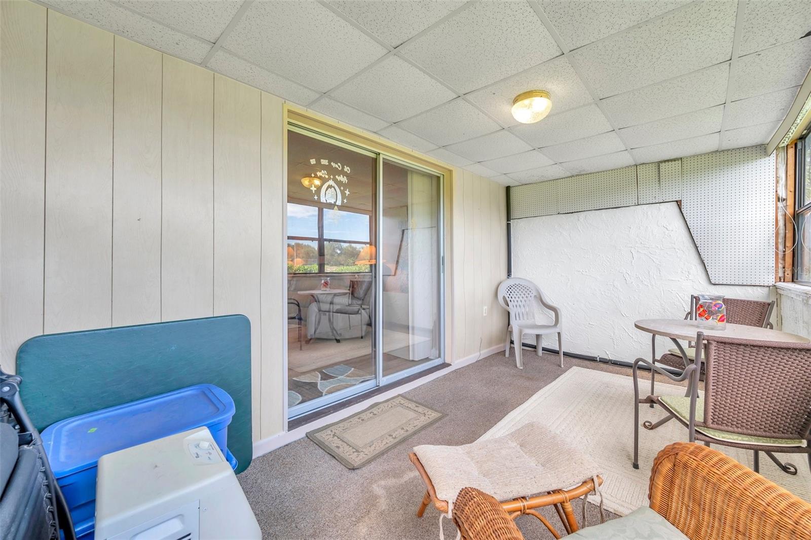 Room to relax, eat dinner in this enclosed porch