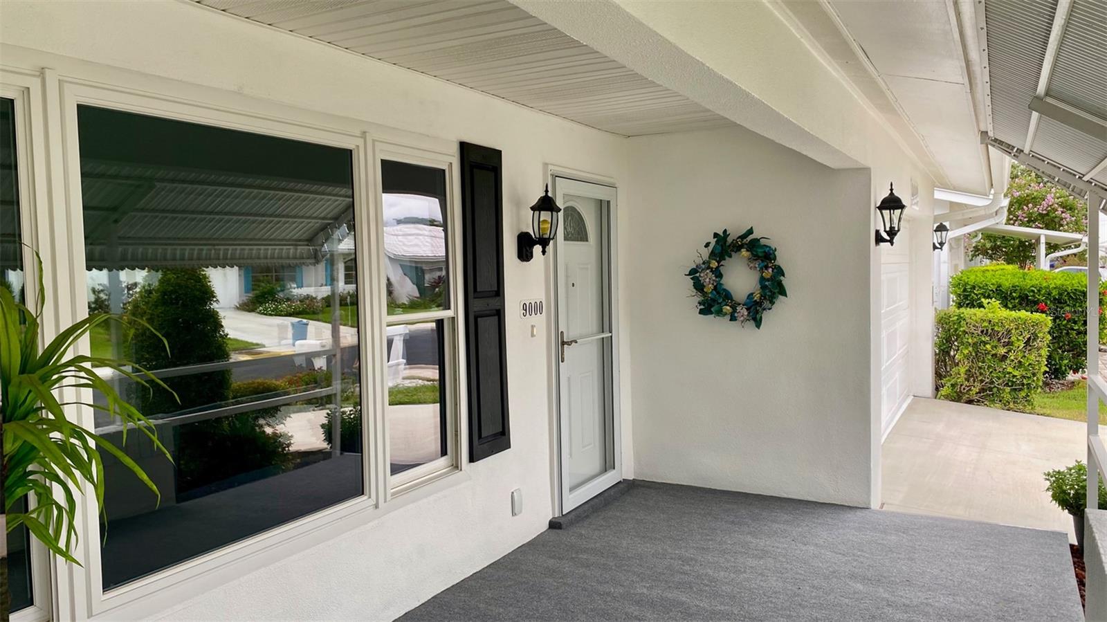 This front porch has amazing breezes thanks to being on a corner lot. The Awning provides the perfect shading as well.