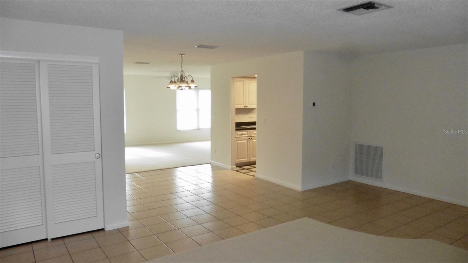 A large hall closet for storage is just off the dining room.