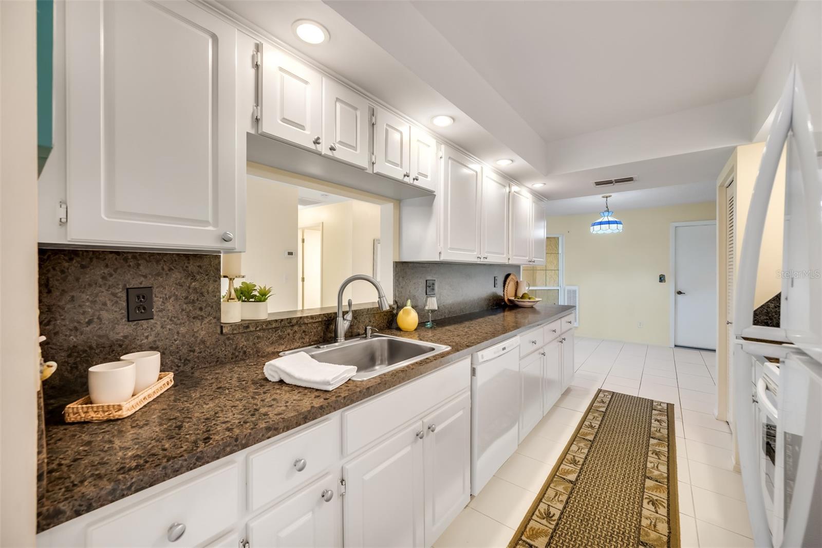 Lots of cabinets and full size pantry in Kitchen for ample storage!