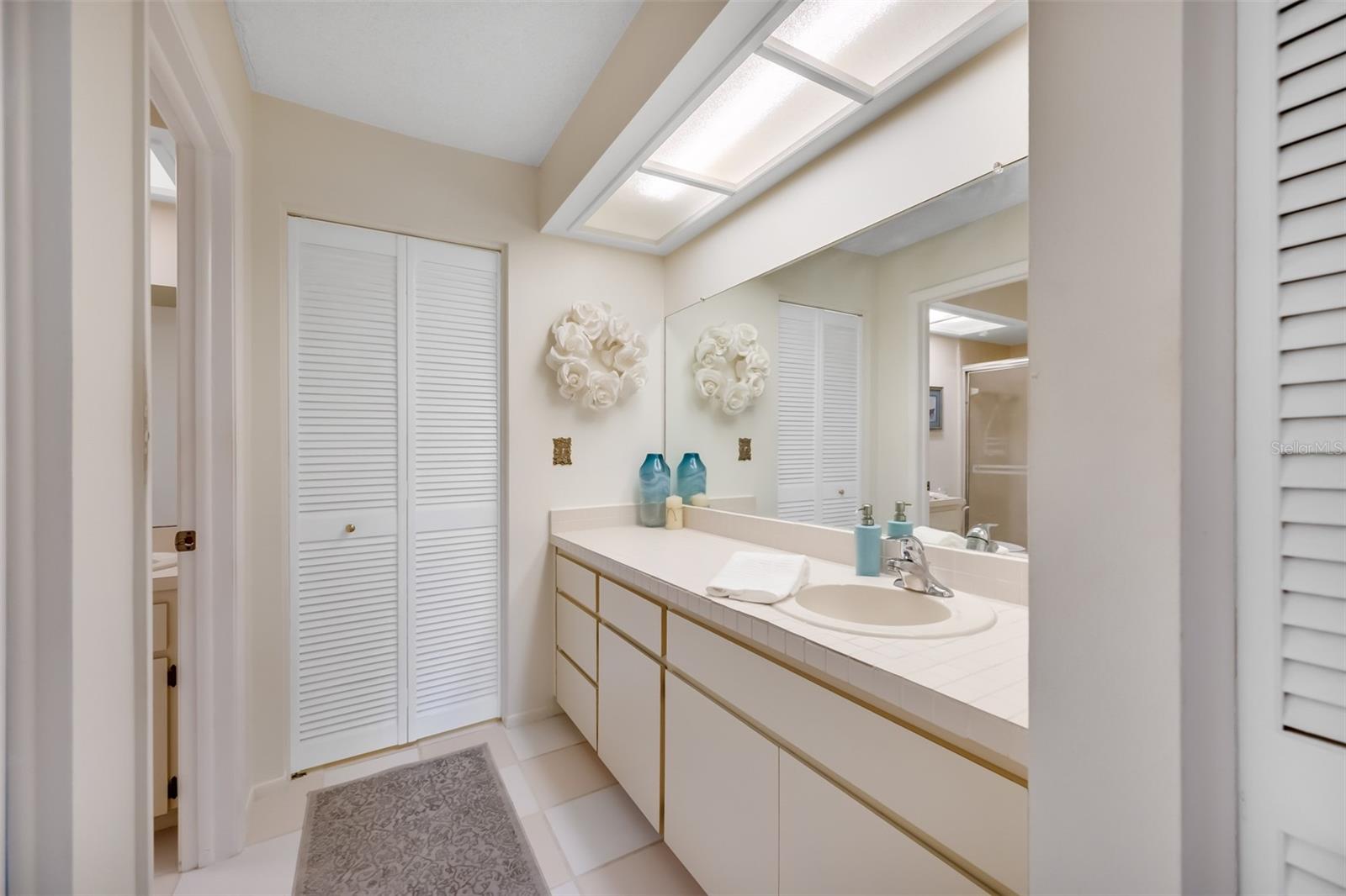 Linen closet on the right side as you enter the primary bathroom