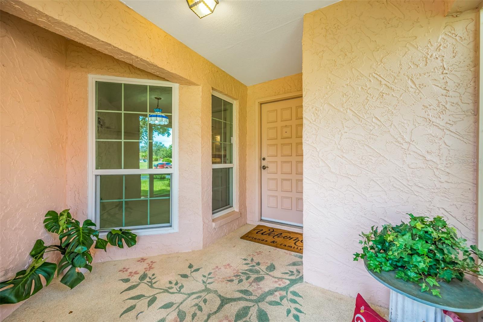 Screened in front entry of home perfect for a morning coffee to watch the world go by!