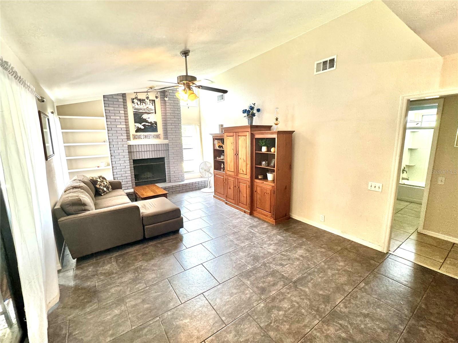 Family room with vaulted ceilings and fireplace