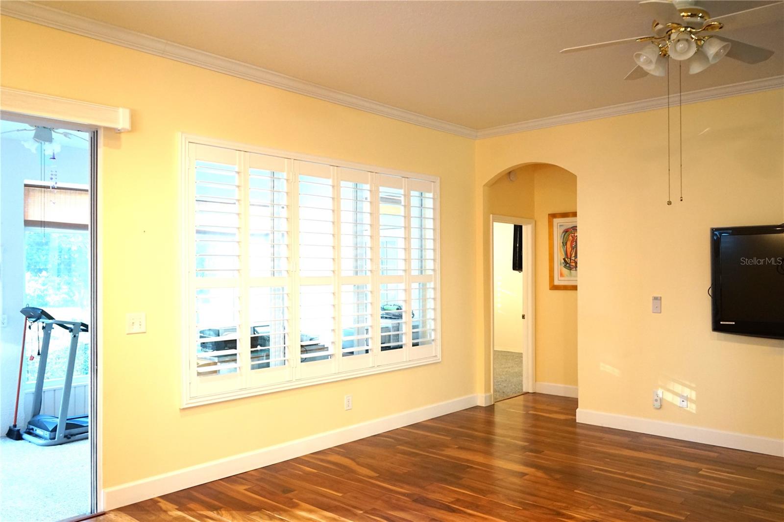 living room with doorway to primary bedroom