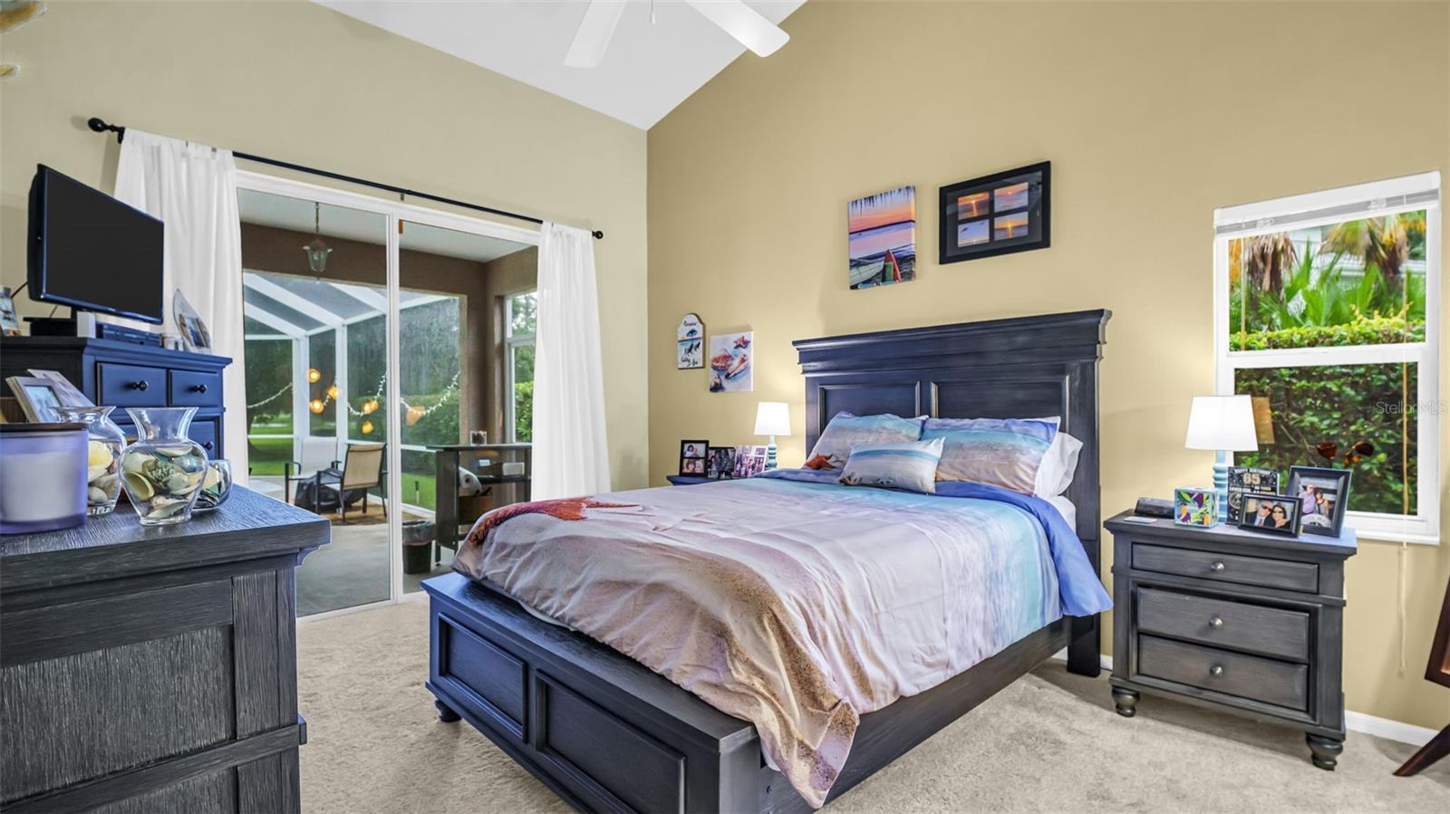 Primary Bedroom with Sliding Doors which Lead to Pool