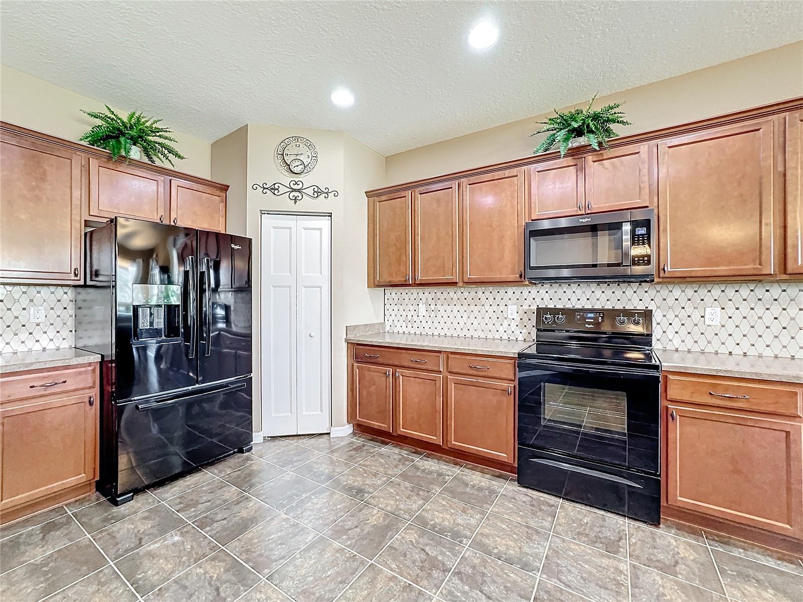 Kitchen looking towards pantry closet