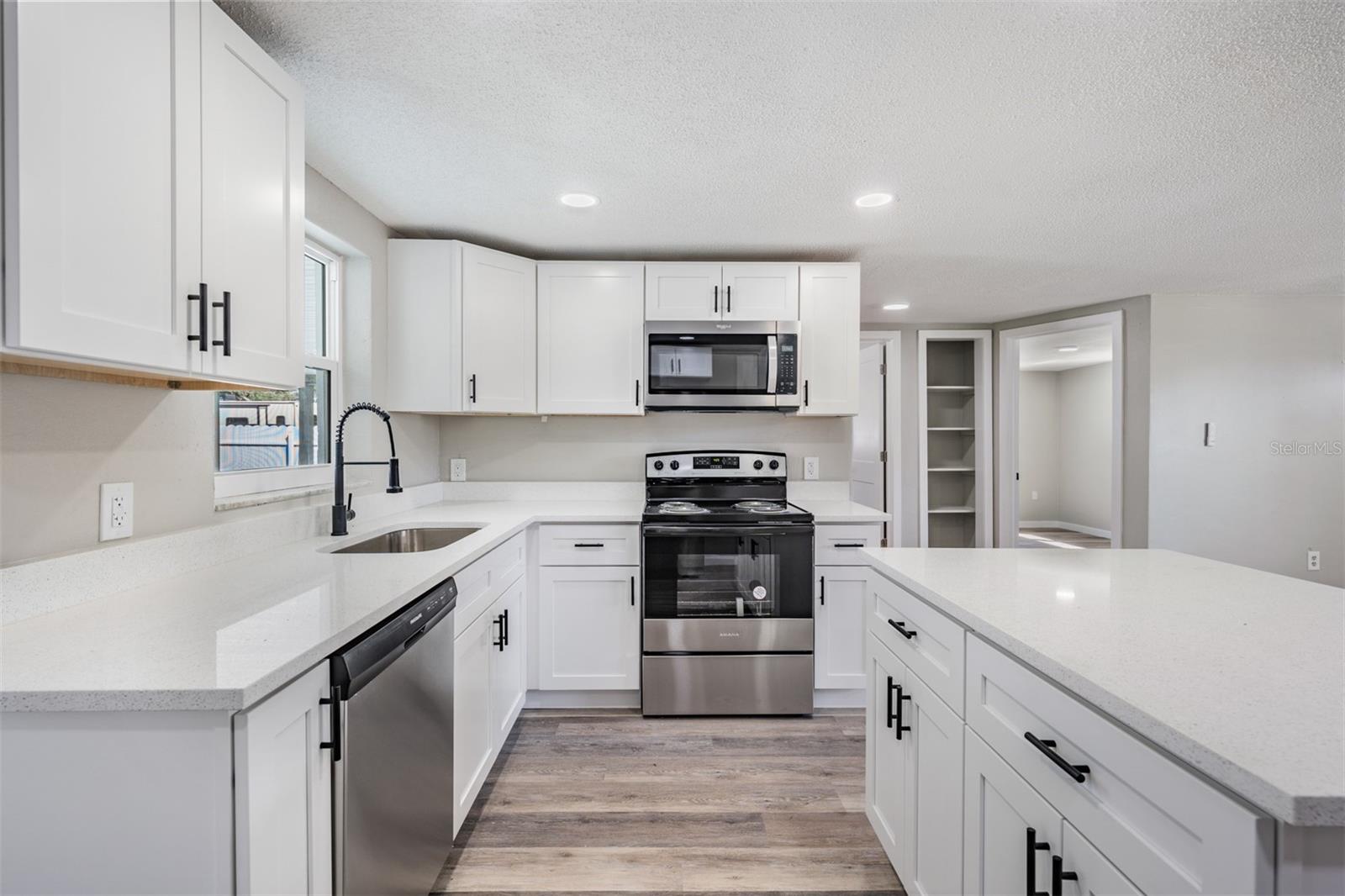 New countertops! New Appliances! New Cabinets with pulls! New Flooring! New Inset Lights!