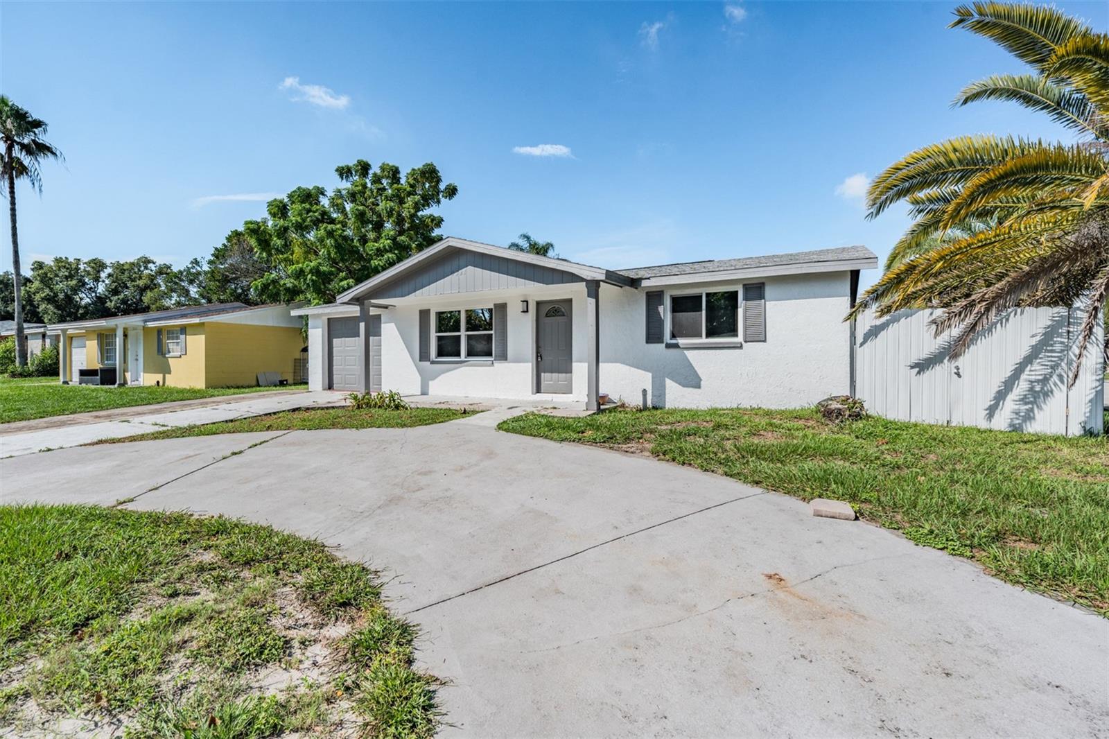 Overview of the home, circular driveway, minutes from the water.