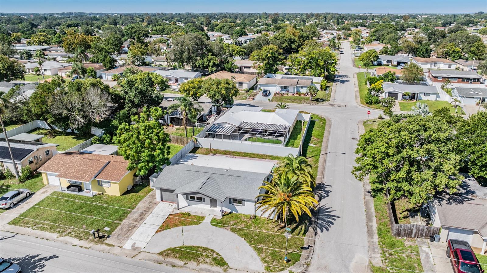 Overview of the home, circular driveway, minutes from the water.