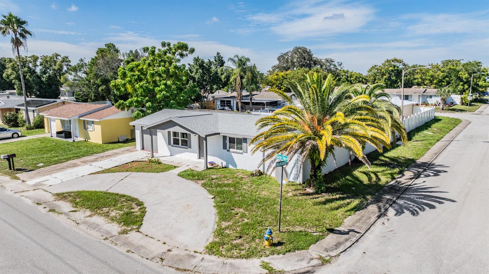 Overview of the home, circular driveway, minutes from the water.