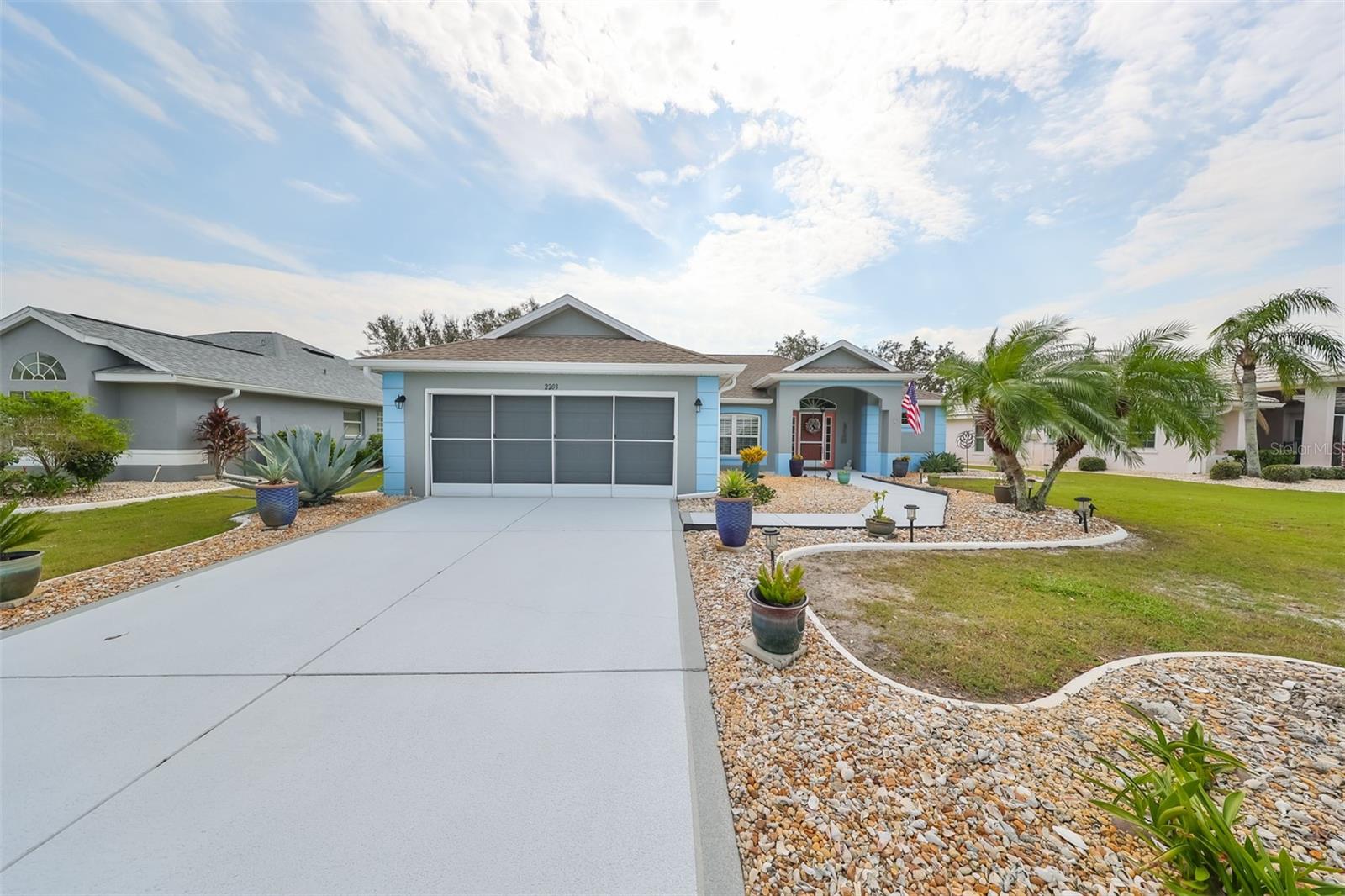 Deep driveway, custom curbing and immaculate landscaping.