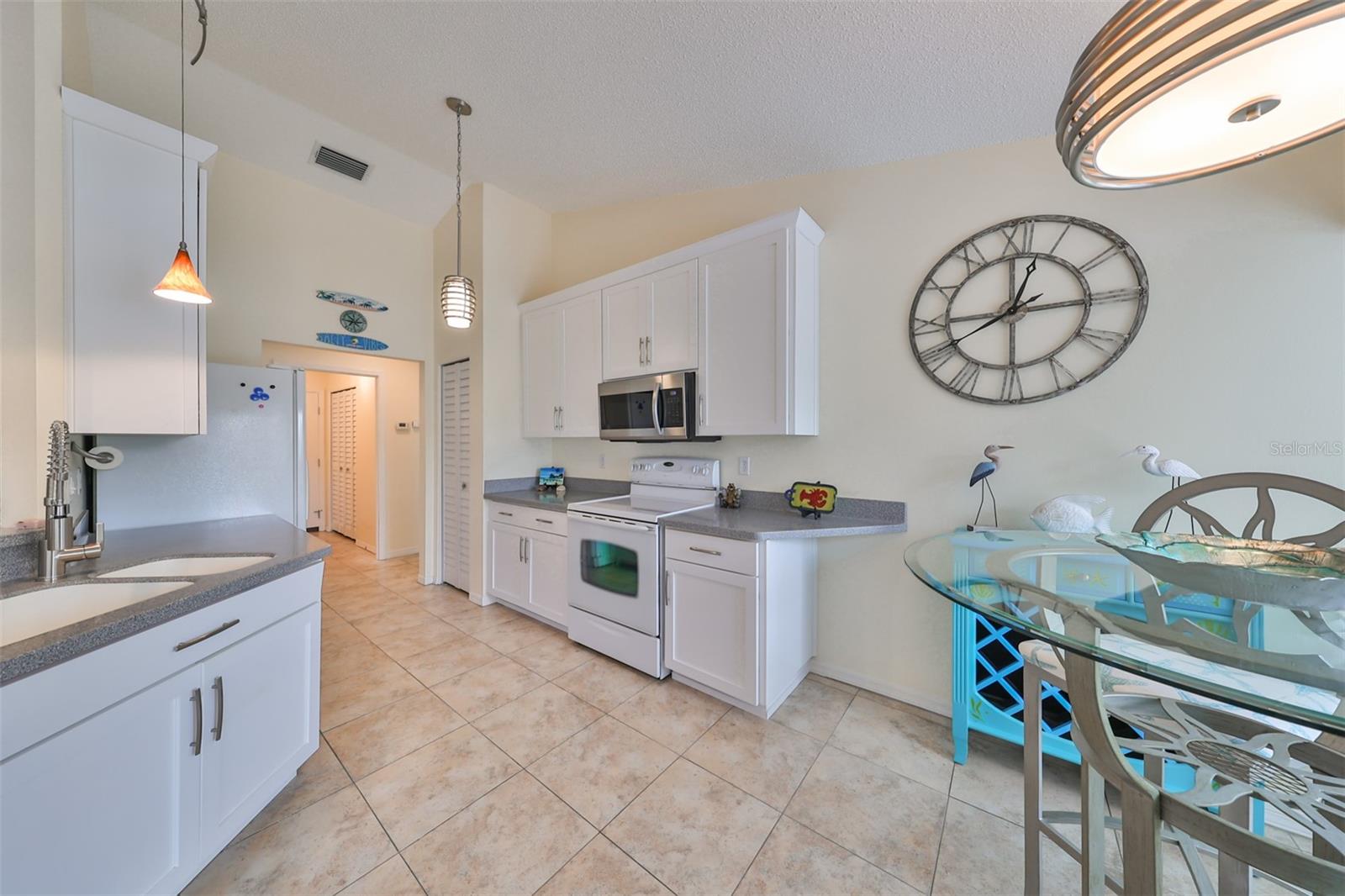 Bright, high ceilings, closet pantry and space make this a great space to work in.