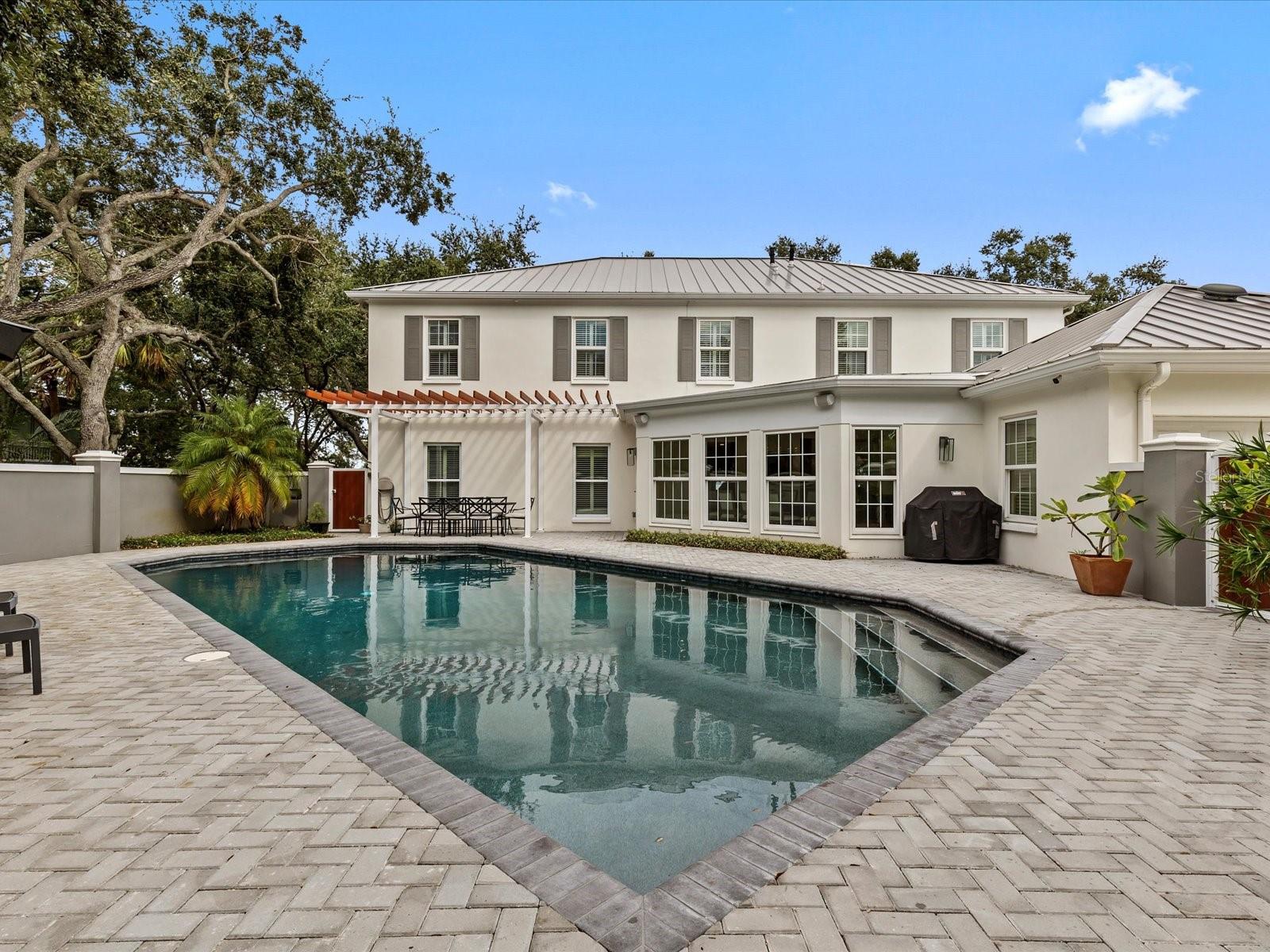 Oversized pool w/ private wall and dining area