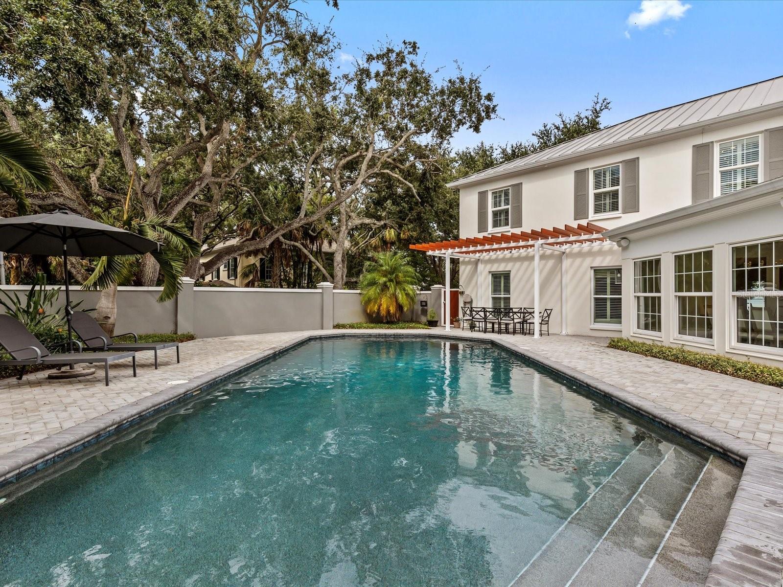 Oversized pool w/ private wall and dining area