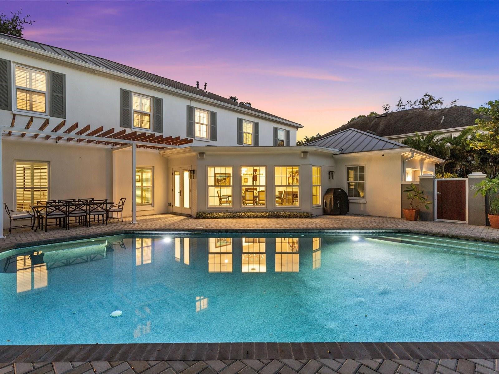 Oversized pool w/ private wall and dining area