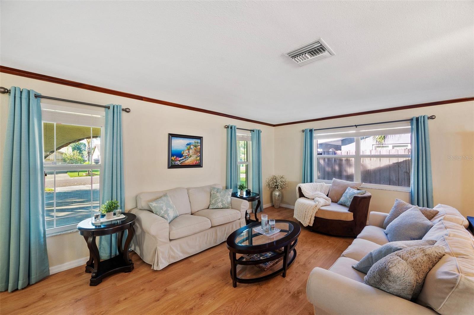 Living Room with many windows prividing natural light.