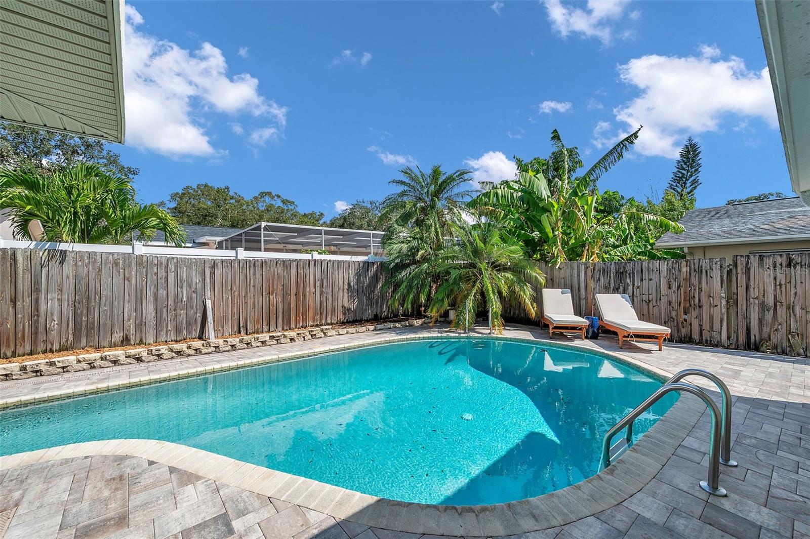 Paver pool deck in fenced backyard!