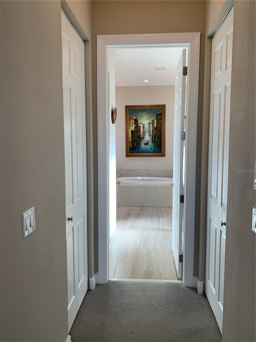 duo right and left walk in closets in master bedroom