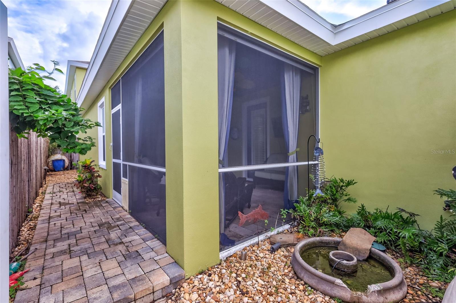 Fenced Backyard Area with Screened Covered Patio