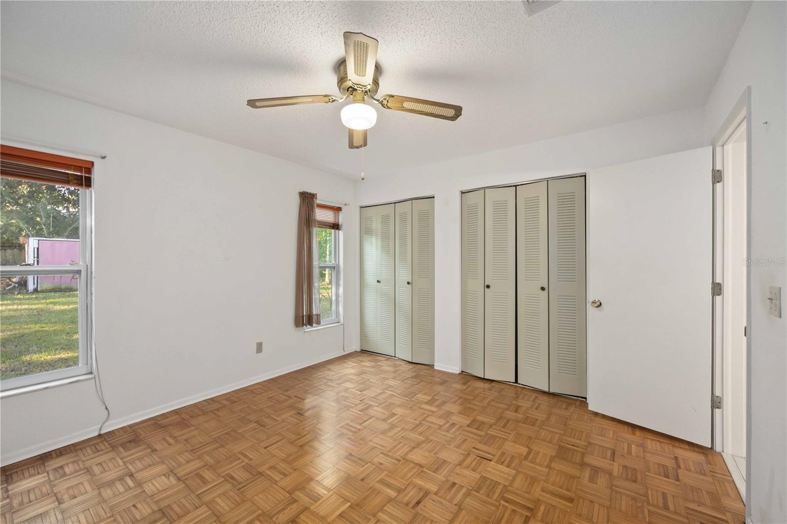 The 2nd bedroom overlooks the back yard.