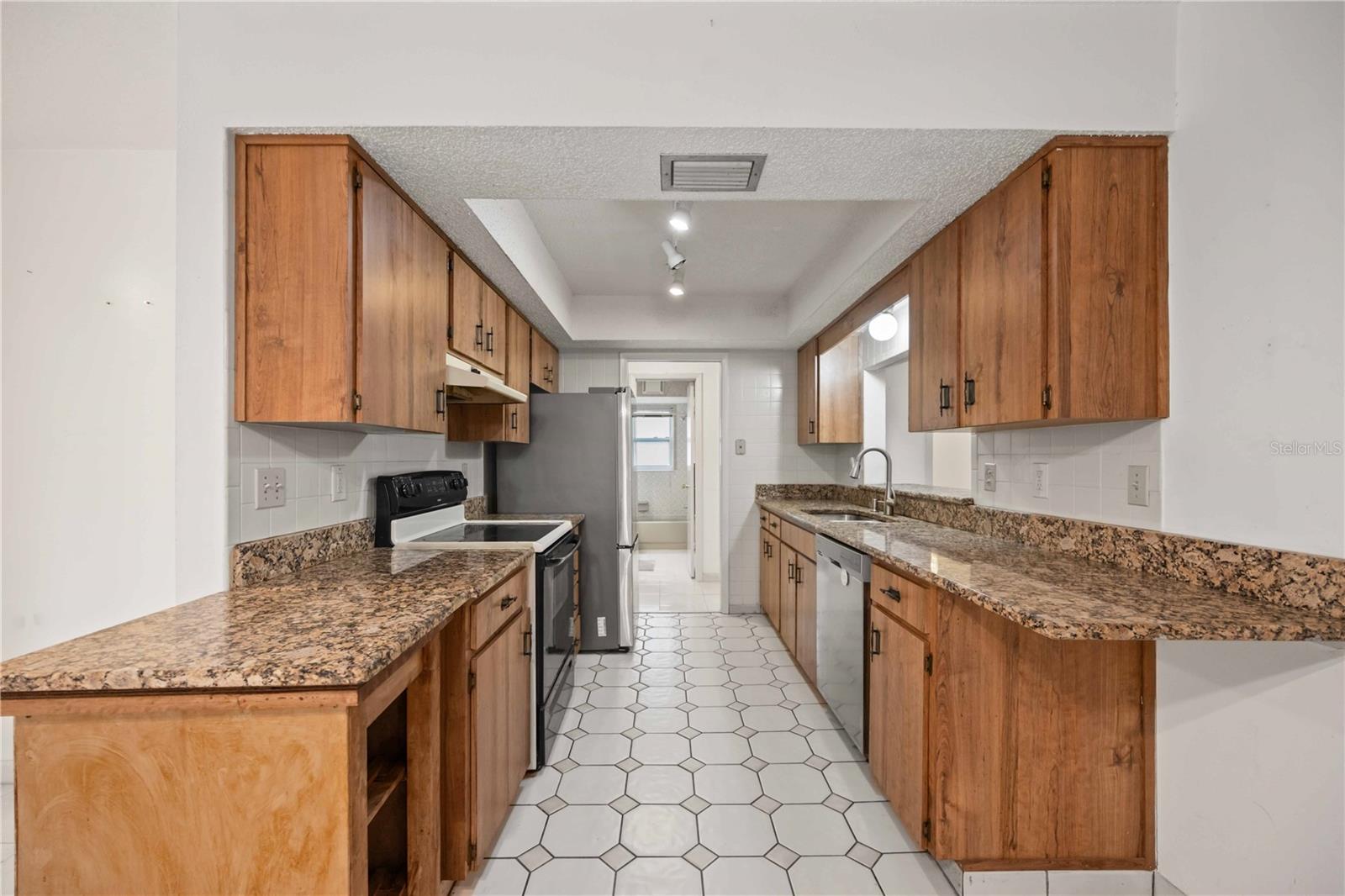 You may want to update the kitchen, but there are granite counters.