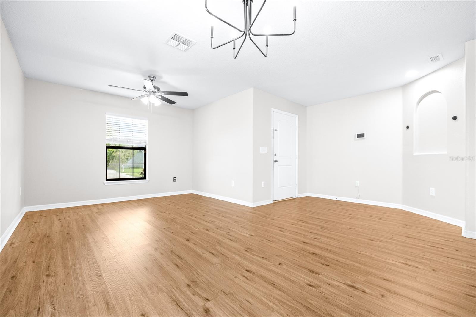 Large flex room off foyer/entryway with contemporary lighting