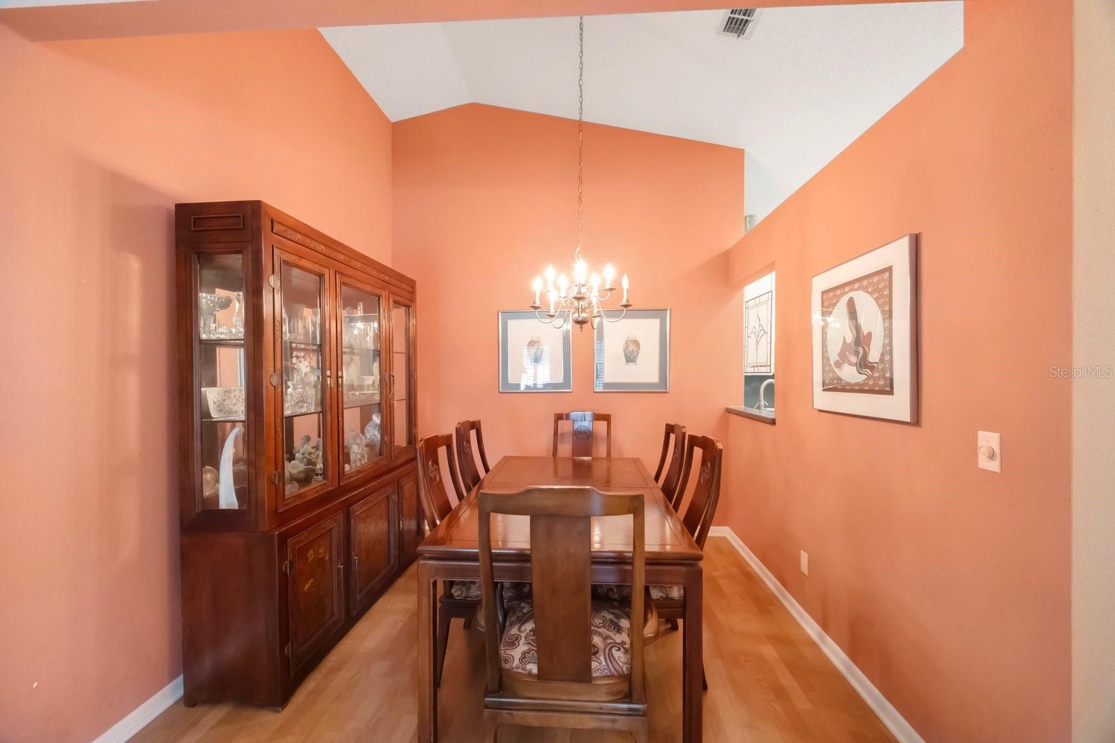 Private dining room has passthru from kitchen for ease of serving.  Note vaulted ceiling.