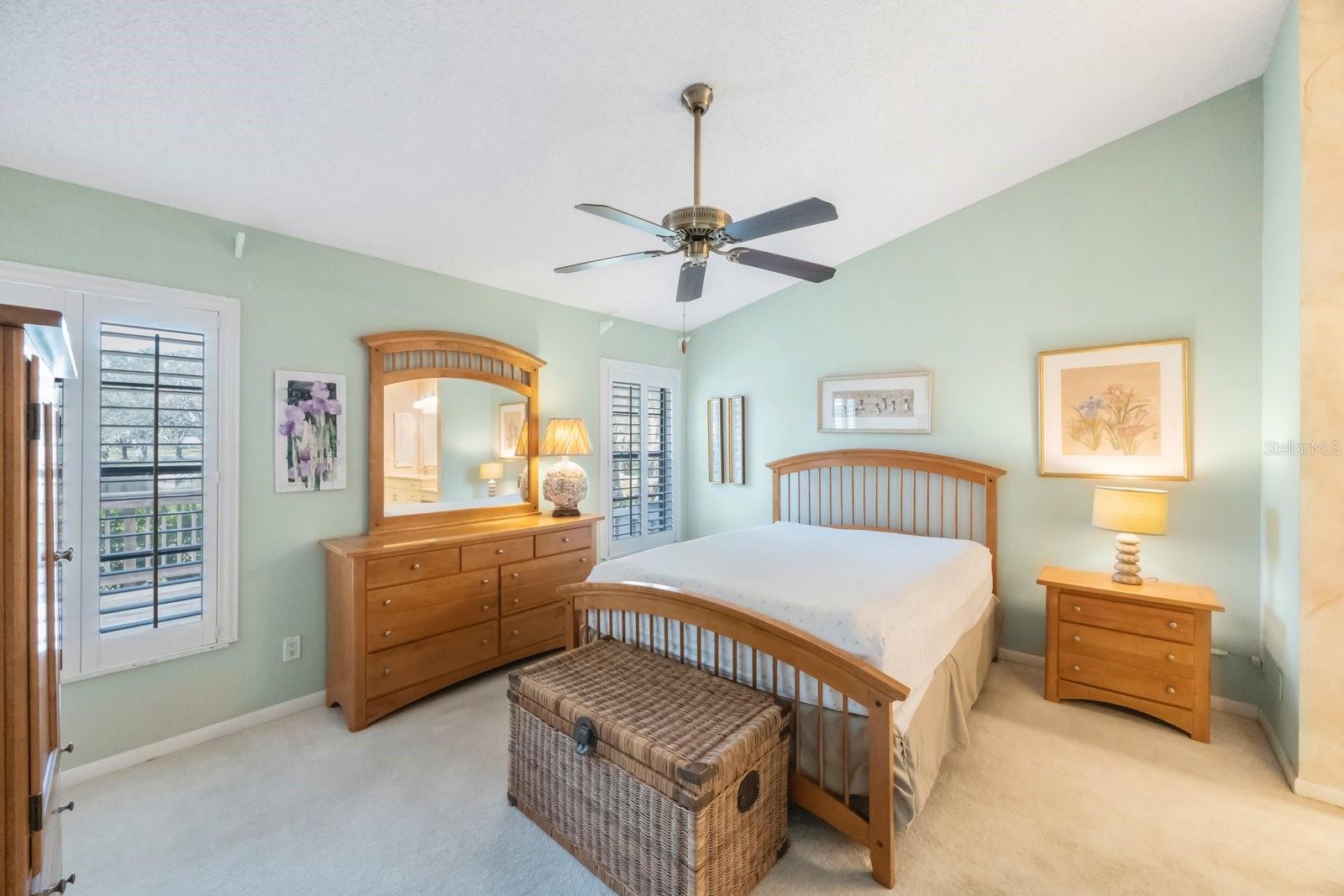 Primary bedroom accommodates king size bed suite, offers high ceilings and lots of light.