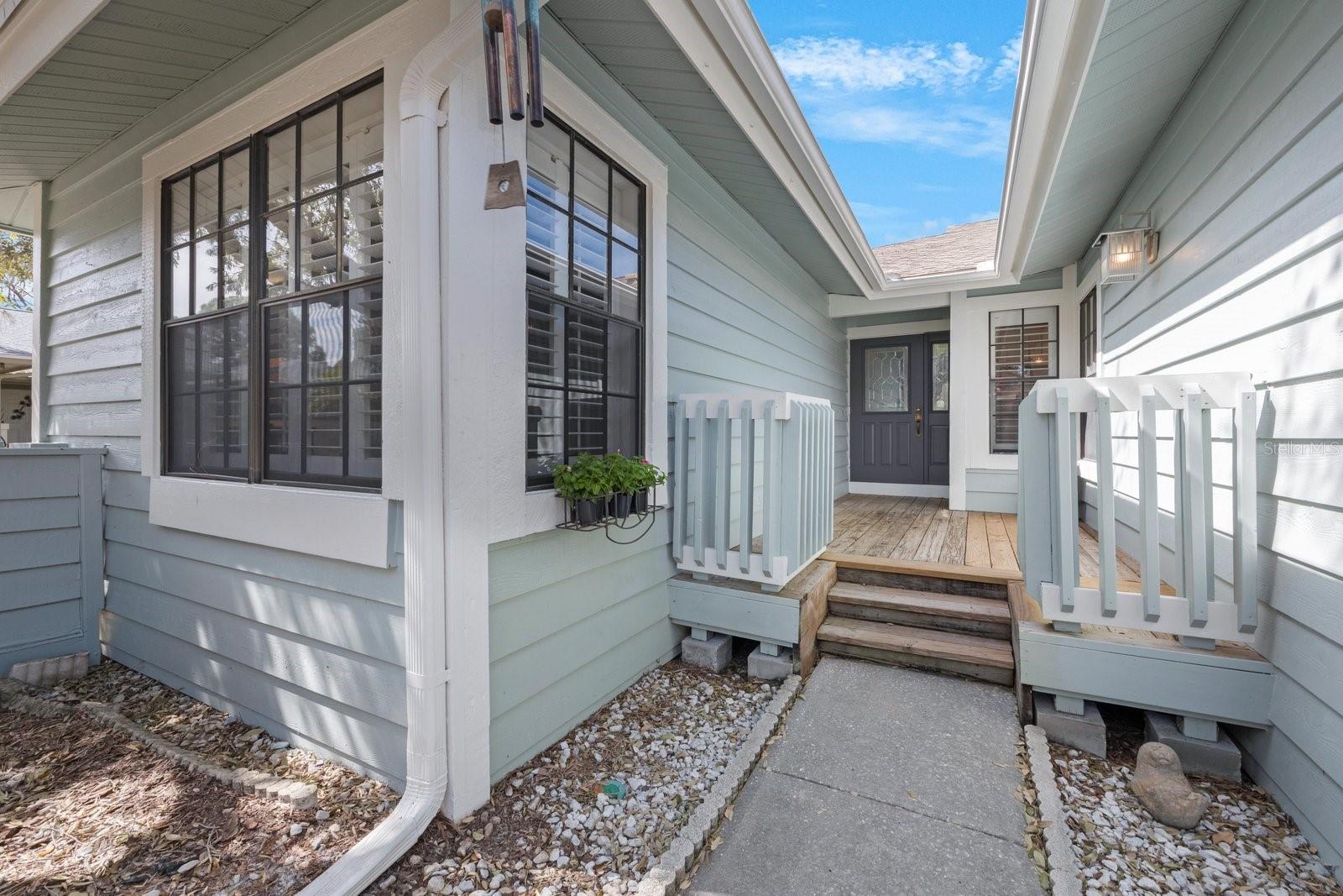 Protected entryway is maintained by the HOA including deck, fence and steps.