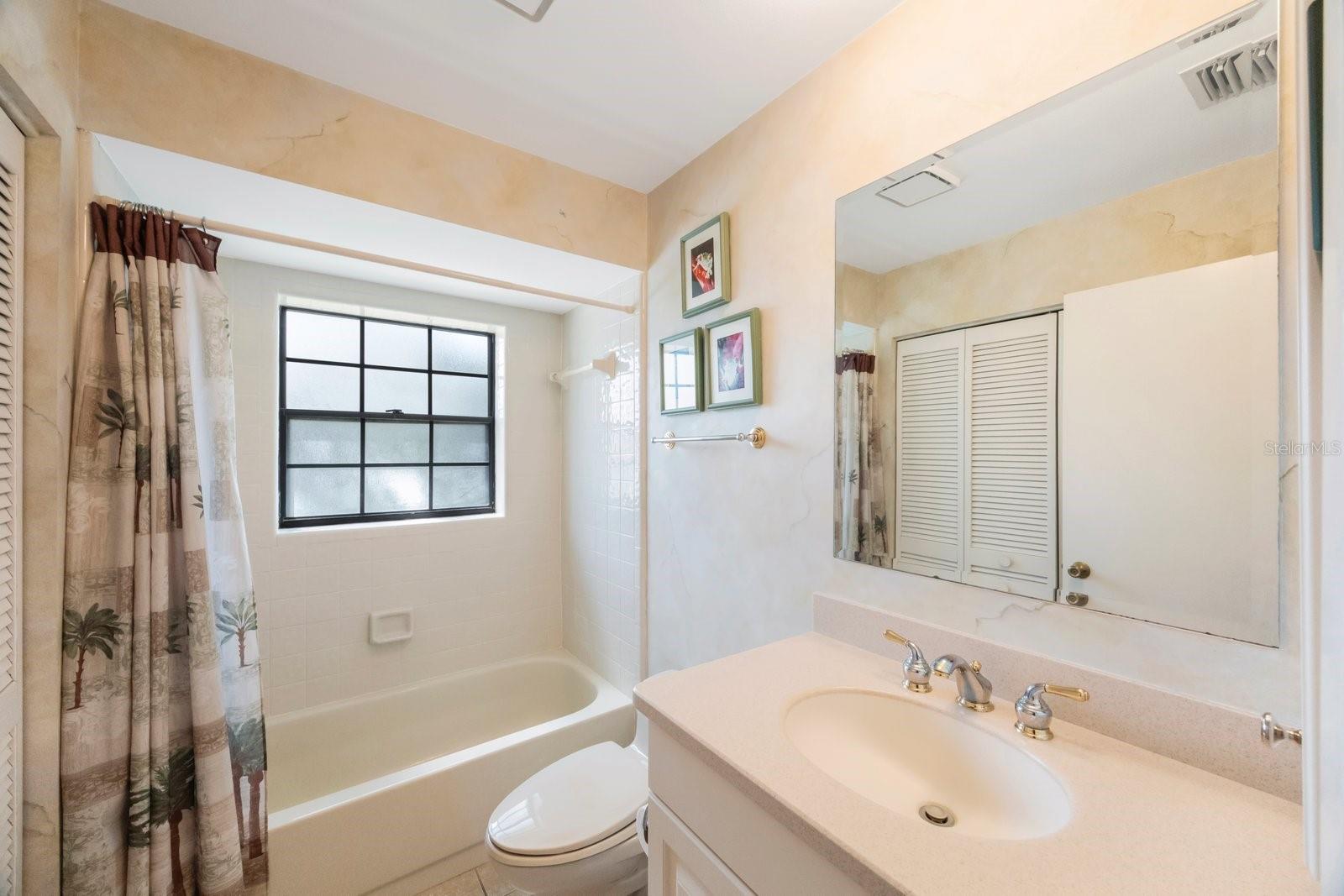 Second bath has tub/shower and provides guest access as well as serving the  bedrooms