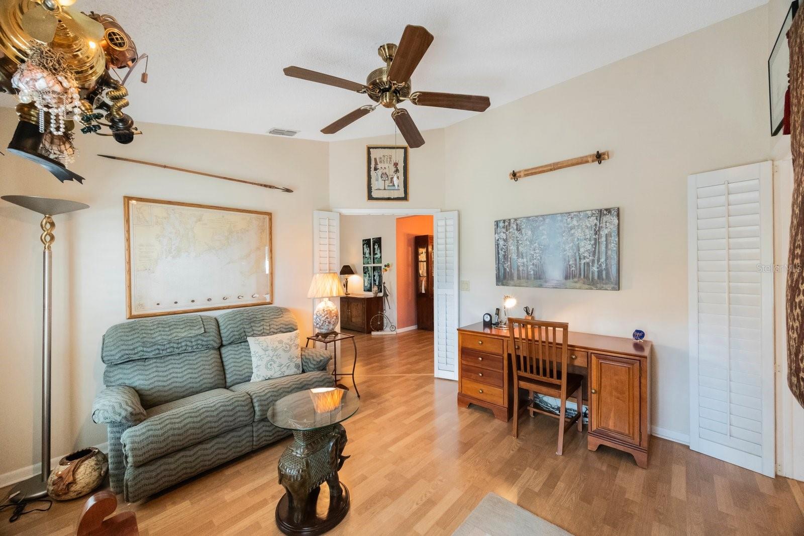 Third bedroom is outfitted as a den.  Laminate flooring is contiguous throughout public areas of the home.