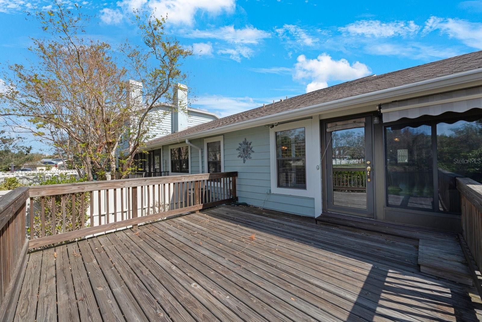 The back deck with access from the sunroom.