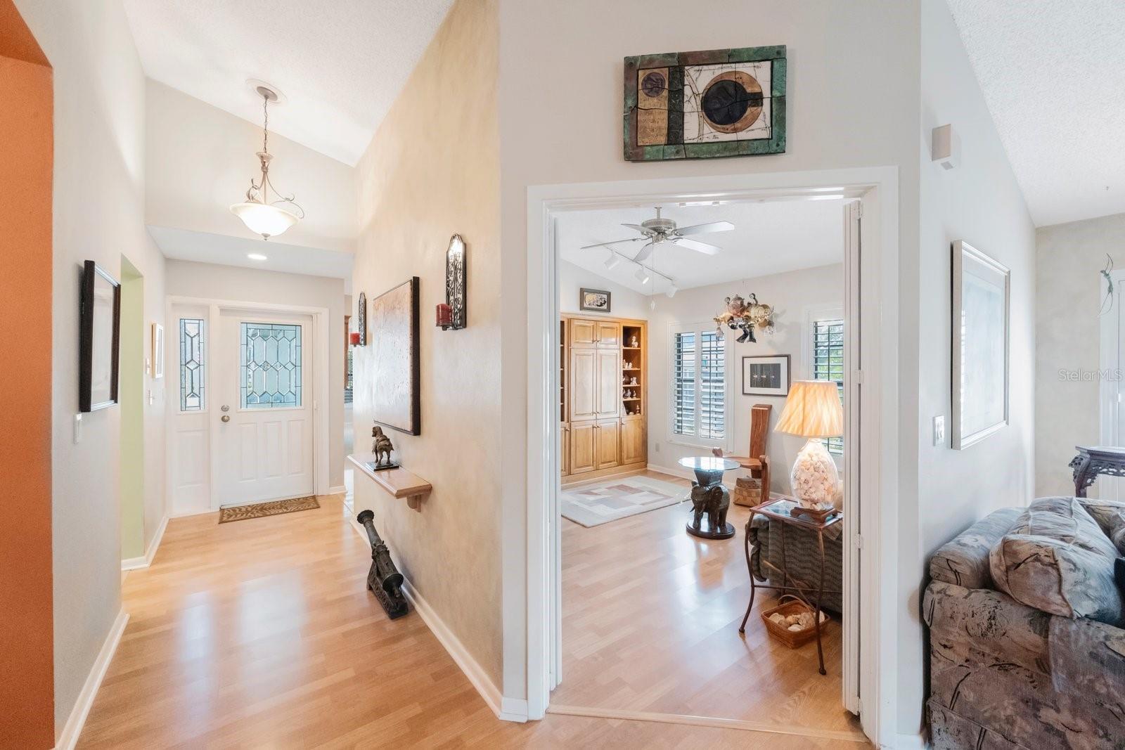 Third bedroom/den is accessible from the living room, note redone laminate floors