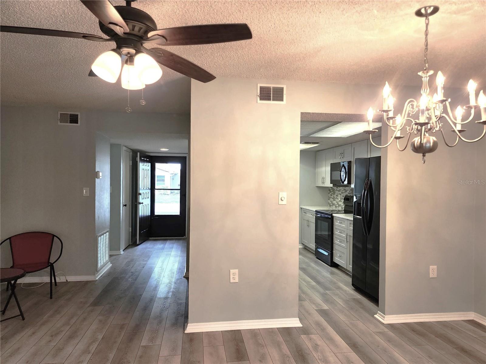 View to the entrance and kitchen from the living room