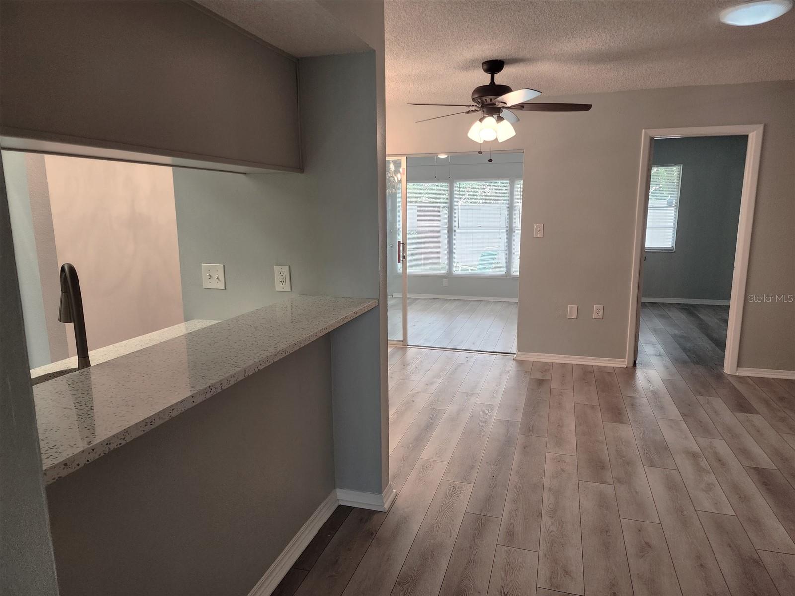 Part of the living room showing the access to the bedroom and lanai