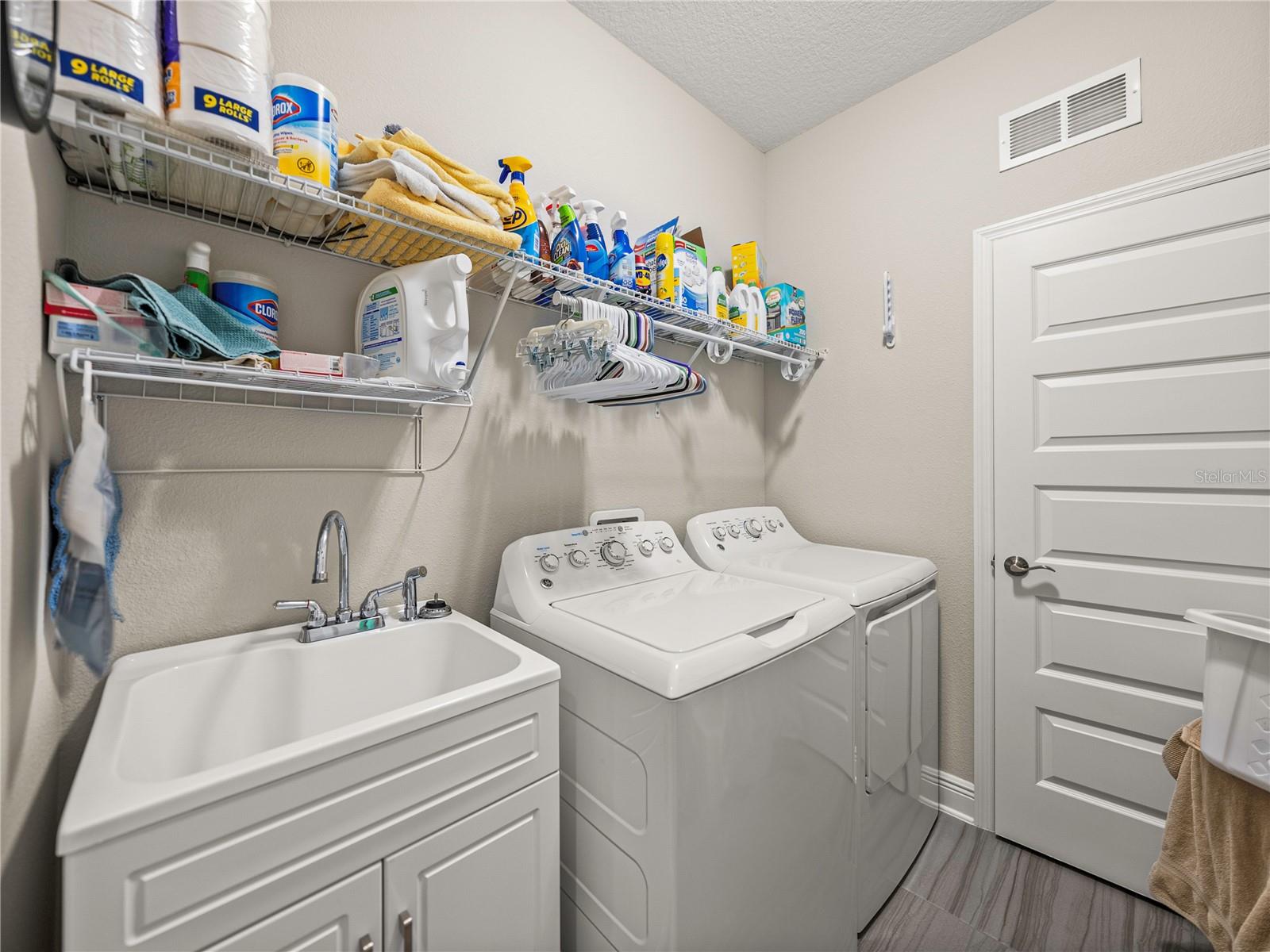 Laundry Room with Laundry Sink and Cabinet