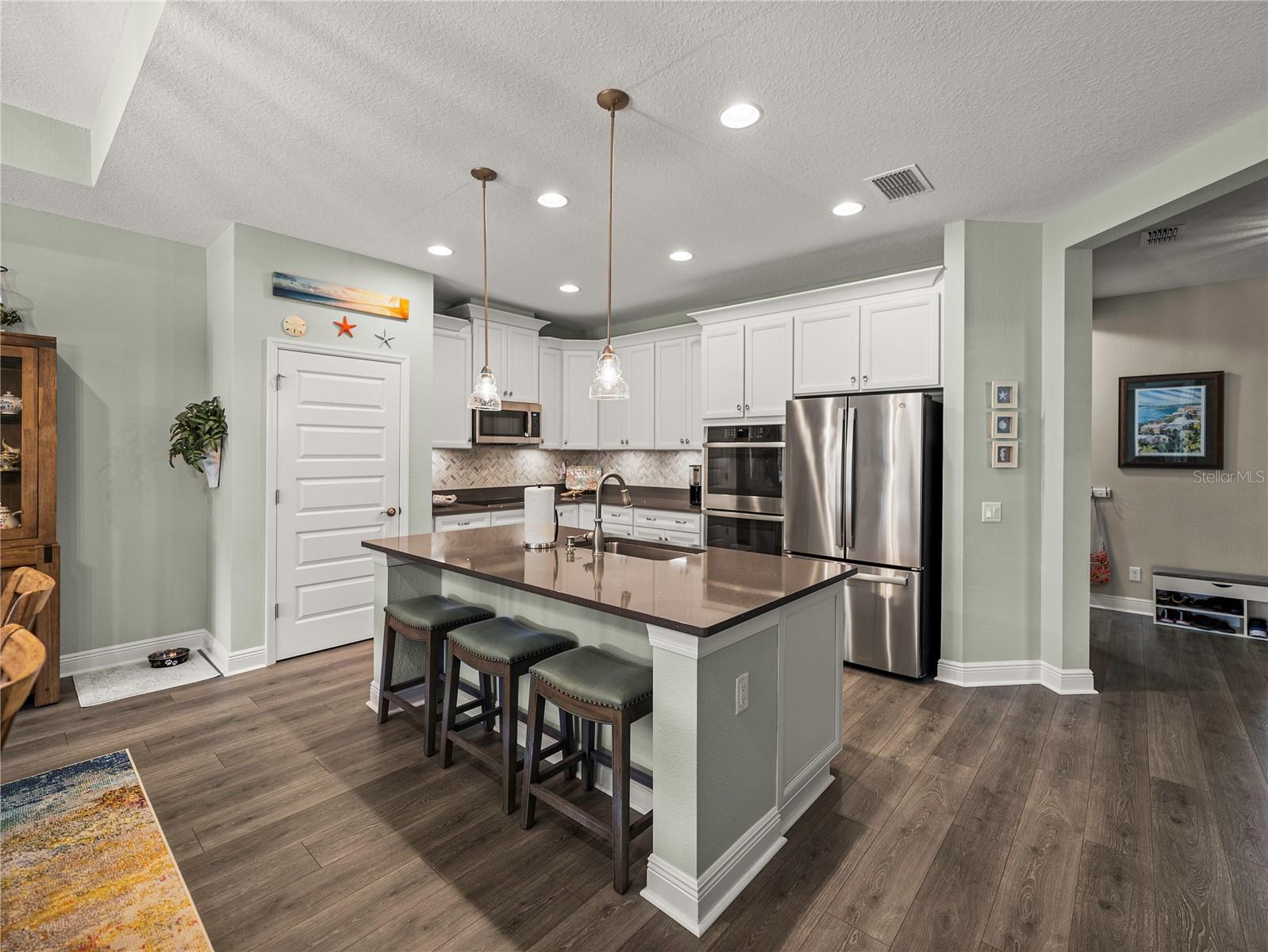 Open Gourmet Kitchen with Counter Height Bar Seating