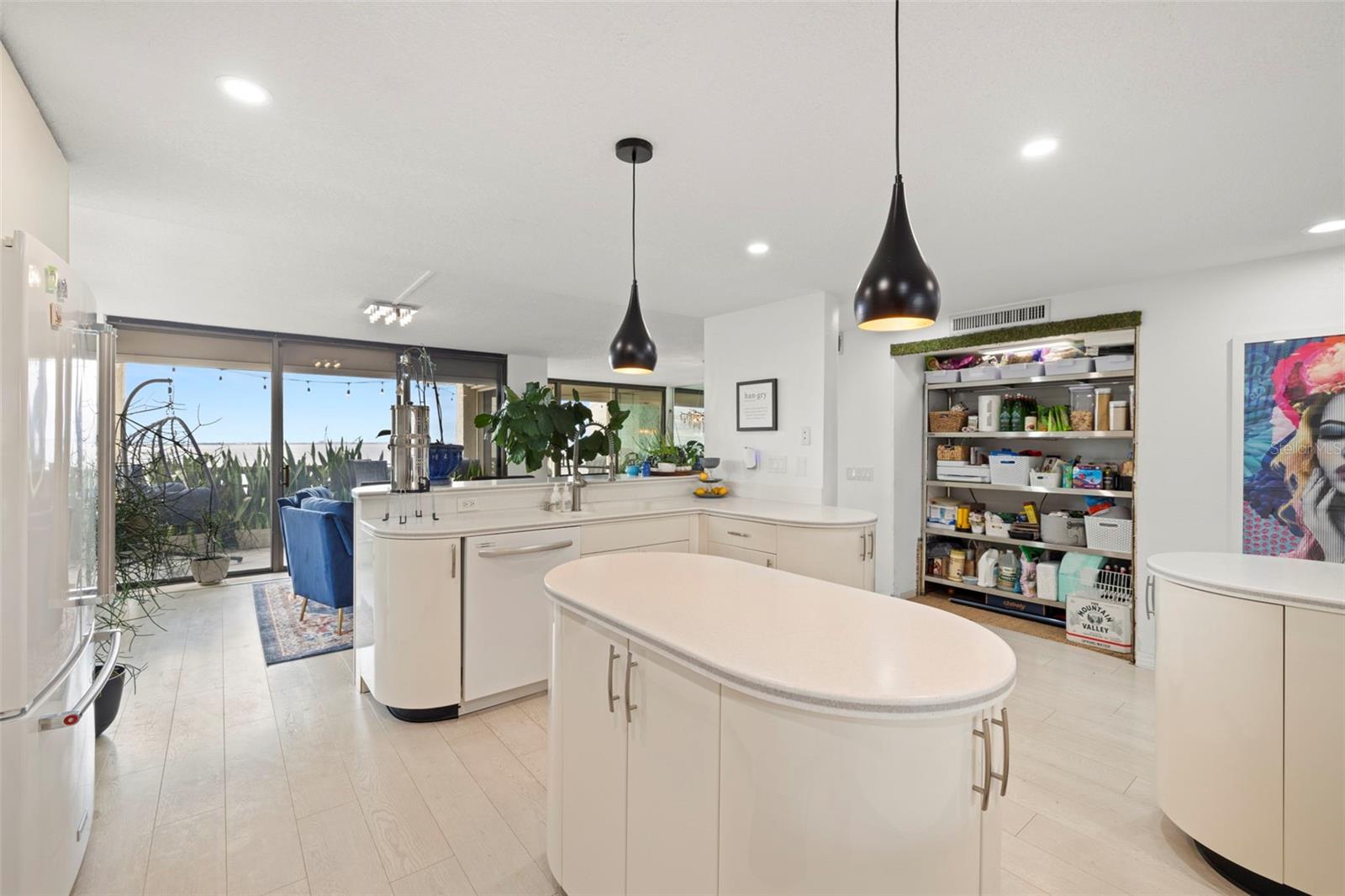 BEAUTIFUL OPEN KITCHEN, PENDANT LIGHTING, GLASS DOOR CABINETRY, CENTER ISLAND