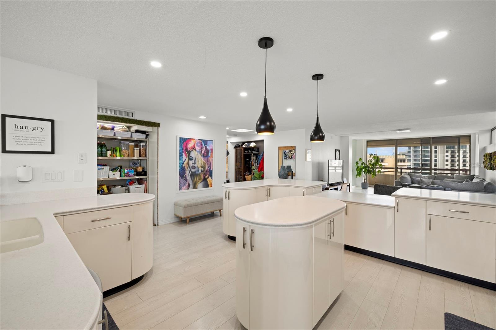 BEAUTIFUL OPEN KITCHEN, PENDANT LIGHTING, GLASS DOOR CABINETRY, CENTER ISLAND