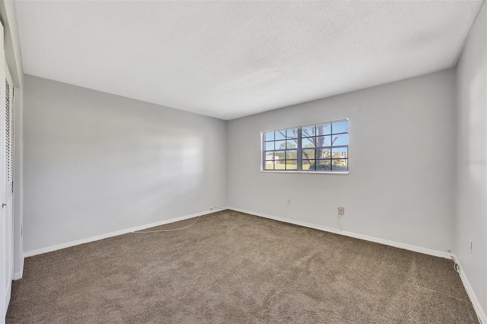 Primary bedroom is spacious with an ensuite and large double closet