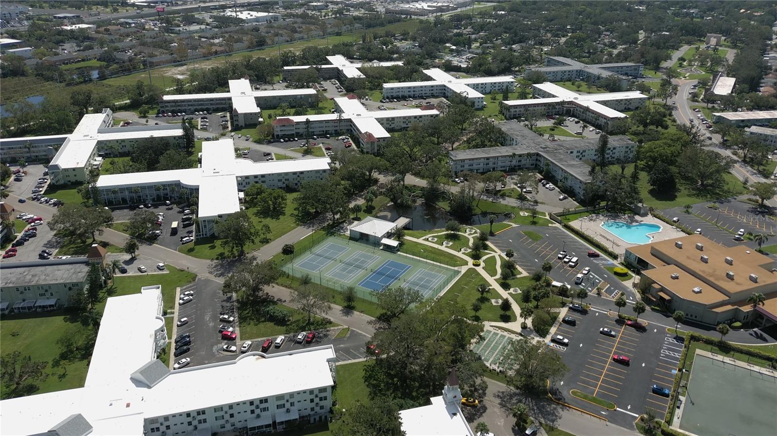 AERIAL VIEW OF THE TENNIS/PICKLE BALL COURTS & POOL