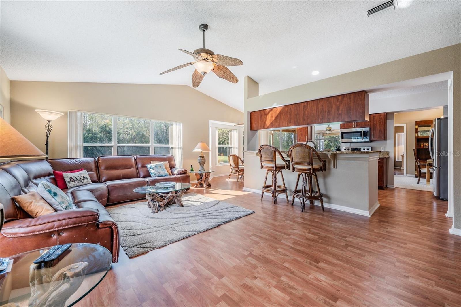 Cozy family room adjoins kitchen, breakfast bar provides additional seating