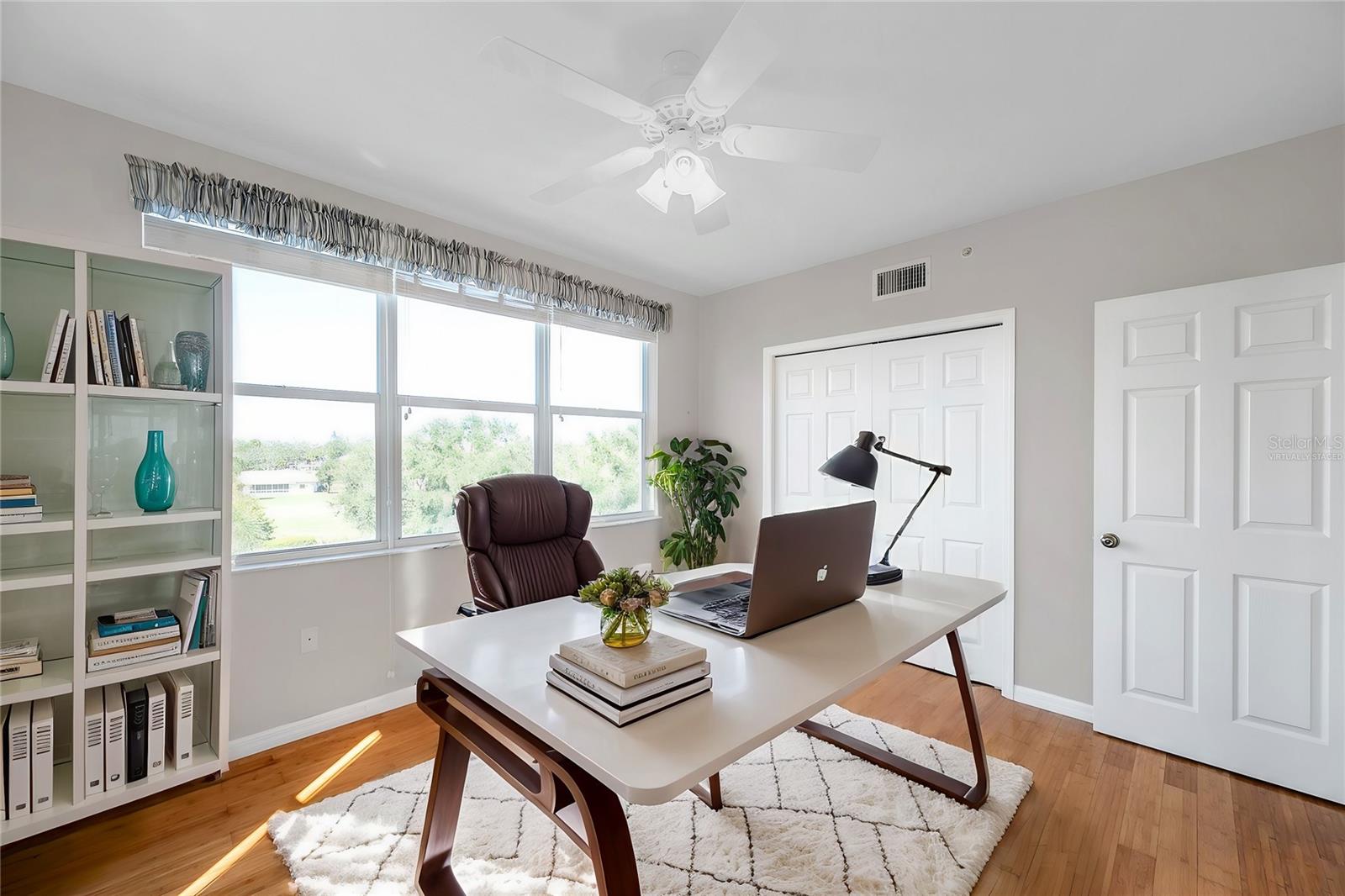 Virtually staged guest bedroom 2 or home office.