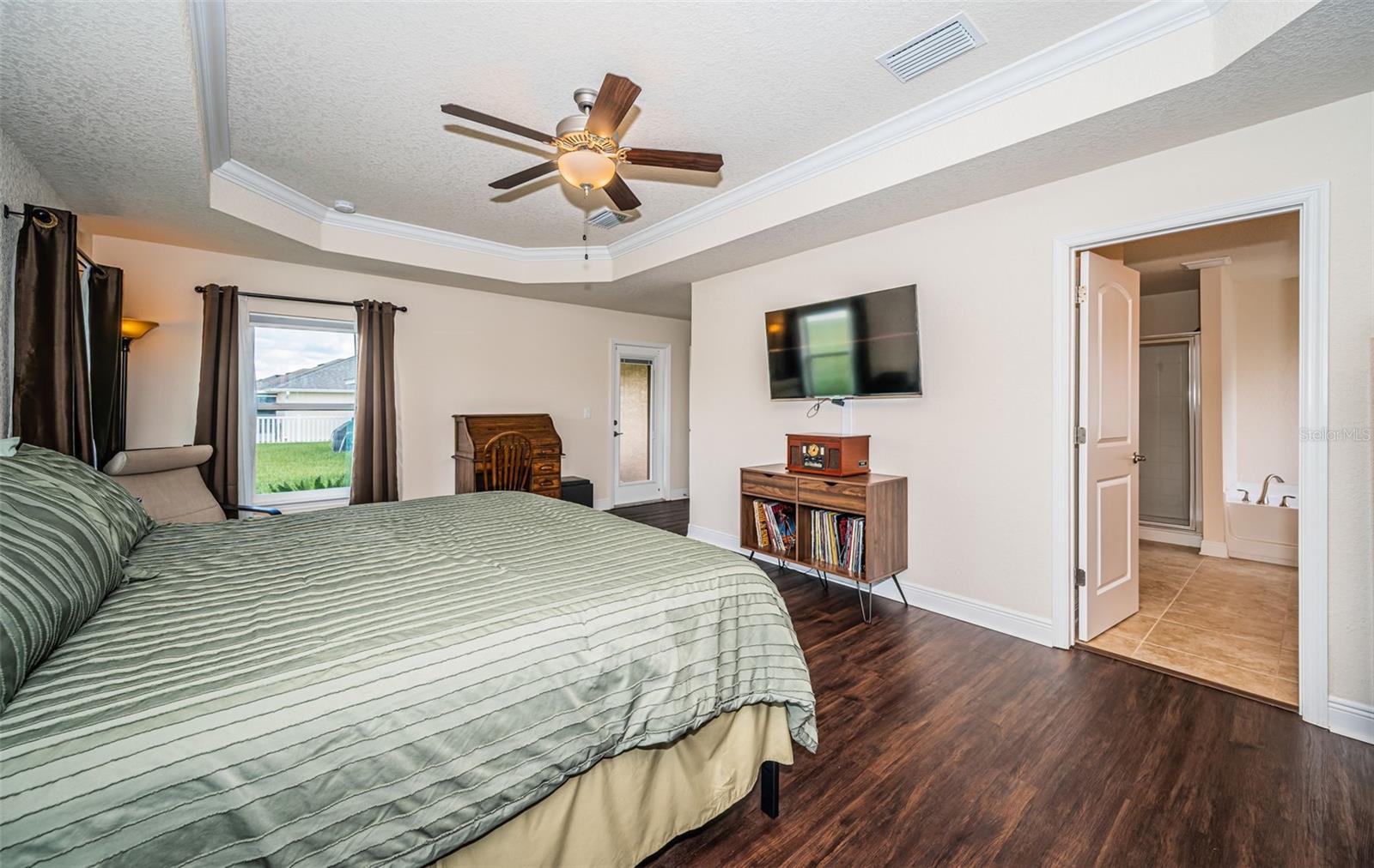 Primary Bedroom with door leading out to lanai