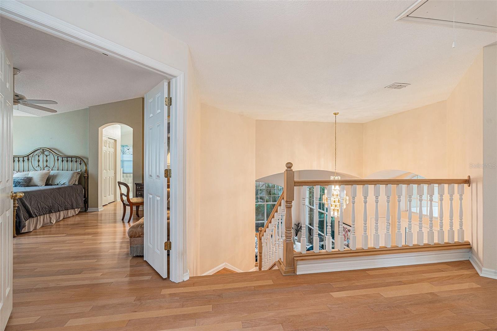 The primary bedroom sits at the top of the stairs