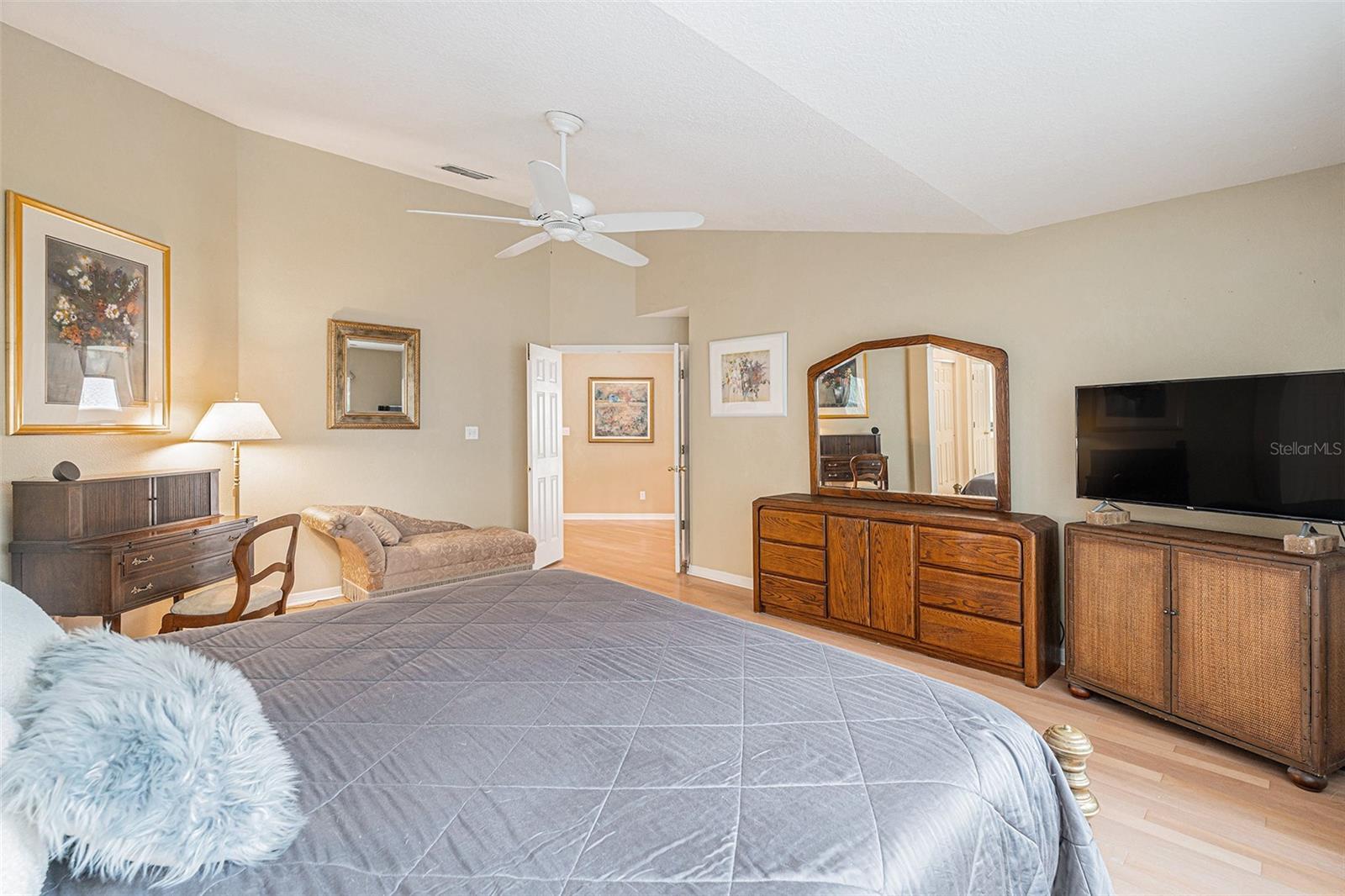 Double doors lead into this amazing primary bedroom for a luxurious feel